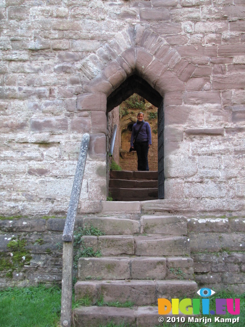 SX16570 Jenni in postern door archway at Goodrich Castle